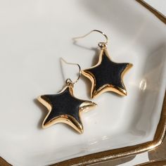 These handmade porcelain ceramic star earrings are truly the star of the show! Measuring .5", these delicate earrings are the perfect size to add a touch of elegance to any outfit. The star itself is adorned with a gold border or a gold polka dot pattern, adding a touch of sophistication to this already stunning design. Whether you choose the border or the polka dot pattern, these earrings are sure to impress! With their handmade, porcelain ceramic construction, these earrings are not only beaut Ceramic Star, Black Stars, Handmade Porcelain, Gold Polka Dots, Gold Border, Delicate Earrings, Stunning Earrings, Black Star, Polka Dot Pattern