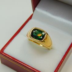 Gemstone: Blue Green Tourmaline Treatments: None Measures: 10x8mm ring Weight: 2.18 carats Clarity: Eye clean Cut: Rectangle cushion cut Metal: Shown in 18K yellow gold Weight: Approx. 12 grams Ring size: This ring is available in all sizes from a low of 5 to a high of 12 This is as fine and elegant a man's ring as you will ever find. The perfect blend of a fine gemstone matched up with a clean classic 18K yellow gold ring. Good solid weight, nicely distributed to give the ring an even weight so Gold Mens Ring, Yellow Gold Mens Rings, Rectangle Cushion, 18k Yellow Gold Ring, Mens Ring, Yellow Gold Ring, Clean Cut, Green Tourmaline, Cushion Cut