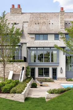 a large house with a pool in the front yard