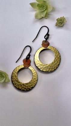 Hammered Hoop Shape Earrings.  I sell only vintage jewelry and I use my pictures as part of the description. As with most vintage items there may be wear consistent with the age.  Find more unique vintage earrings and jewelry in my store at AllieAnneCo.etsy.com Thank you for stopping by! 😊 https://www.etsy.com/shop/AllieAnneCo Vintage Gold Hoop Earrings In Brass, Retro Dangle Earrings For Pierced Ears, Gold Retro Hoop Earrings For Gift, Retro Gold Brass Earrings, Vintage Brass Drop Earrings, Retro Pierced Drop Earrings, Vintage Gold Single Earring, Gold Round Soldered Earrings, Retro Dangle Metal Earrings