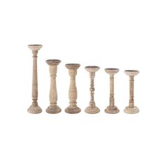 six wooden candlesticks lined up in a row