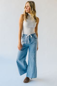 Be the center of attention with The Towslee Wide Leg Denim Jean! These light blue jeans are not your ordinary pair. The wide leg design effortlessly elongates your figure, while the light blue color adds a playful touch to your outfit. Perfect for standing out in any crowd! Details Model is wearing a small self/lining: 100% cotton Fabric Care Guide Here Sizing & Fit Measurements are approximate and taken while laying flat across the front. Not doubled. small: waist = 12"; length = " medium: wais Casual Medium Wash Wide-leg Cropped Jeans, Light Wash Wide-leg Cropped Denim Jeans, Light Wash Wide-leg Cropped Jeans, Light Blue Wide Leg Jeans For Summer, Light Blue Wide Leg Denim Bottoms, Spring Light Blue Wide Leg Jeans, Light Wash Wide-leg Denim Flare Jeans, Light Wash Wide-leg Flare Jeans, Light Blue Wide Leg Cotton Jeans