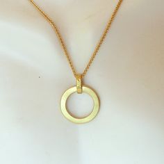 This is an 18K gold circle pendant. It has a classic round circle shape. Its handmade and is elegant and sportish and fits any occasion. Great addition to any jewelry collection. Size:outer diameter: 18 mm Metal: 18K solid gold The pendant will be shipped elegantly gift wrapped. Necklace Gold Pendant, Pendant Necklace Gold, Handmade Fine Jewelry, Circle Pendant Necklace, Gold Circle, Round Circle, Circle Shape, Fine Jewelry Gift, Circle Pendant