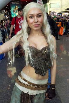 a woman with long white hair is posing for the camera