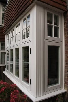 an image of a house with white windows