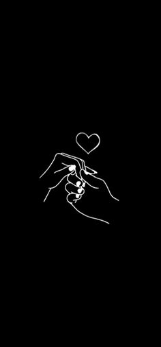 two hands touching each other with a heart above them