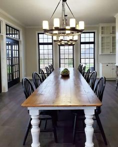 a large wooden table with chairs around it