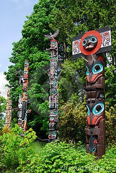 totems in the woods with trees and bushes