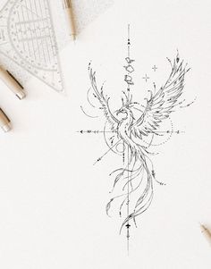 a drawing of a bird with wings on it's back, surrounded by markers and pencils