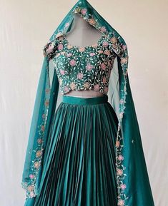 lehenga set  |womens lehenga choli |green crop top lehenga set |designer lehenga dupatta | wedding lehenga choli | green multi color lehenga usa Women's lehenga set /chinnon silk skirt/voggish /dark green designer lehenga       lehengas are one of the beautiful and versatile traditional attires of india !! we carry such pieces in budget with great quality that can be styled in multiple ways with different outfits !!       Here is Beautiful dark green color heavy gear soft chinnon silk lehenga paired with matching pure raw silk heavy multicolor hand embroidered blouse at front butis ar the back  and hand embroidered dupatta as shown paired with same chinnon dupatta as shown !! Skirt has heavy gear and both pieces can be mix and matched with different outfits !! Ready to ship All over the wo Indian Crop Top, Multi Color Lehenga, Indian Crop Tops, Green Silk Skirt, Top Lehenga, Heavy Gear, Lehenga Indian, Crop Top Lehenga, Lehenga Dupatta