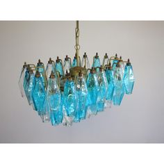 a chandelier with blue glass bottles hanging from it