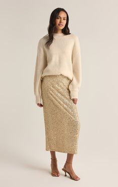 Sparkle all day and night in this sequin midi skirt. Made using our Stretch Sequin fabric, this fully lined, slim fitting elastic pull-on skirt will instantly add eye-catching appeal to your festive wardrobe. London Lookbook, Skirt With Sweater, Sequin Midi Skirt, Sparkle Skirt, Lounge Bra, Comfy Chic, Cozy Chic, Sequin Fabric, Ribbed Neckline