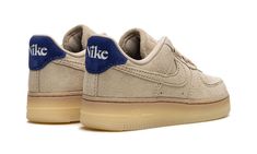 The Women’s Nike Air Force 1 Low "Grain" is a women’s-exclusive colorway of the classic basketball sneaker with a hairy suede construction.  The versatile shoe features what Nike is calling a Grain-colored suede appearance, including on the overlays and Swoosh.  Classic “Nike” branding is seen on the tongue.  Deep Royal Blue accents land on the heel with retro-inspired “Nike” detailing.  Underfoot, the color of the semi-translucent rubber sole matches the upper to complete the look.  Release dat Nike Branding, Deep Royal Blue, Nike Brand, Nike Air Force 1 Low, September 22, Basketball Sneakers, Air Force 1 Low, Blue Accents, Nike Air Force 1