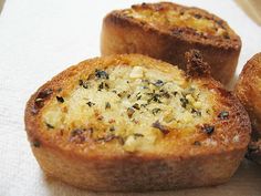 two pieces of bread sitting on top of a table