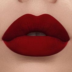 LONG-WEARING | NON-DRYING | DOE FOOT APPLICATOR Shade: Belladonna Be bold with a showstopping pout! This lightweight satin-matte lip color features a deluxe hydrating formula and provides extreme color payoff in one saturated swipe. Deep Red Lipsticks, Red Lipstick Matte, Orange Lips, Best Lipsticks, Winged Liner