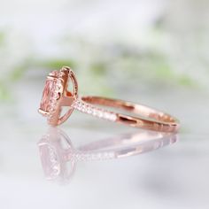 Beautiful Classic Morganite Halo Ring ►Base Metal: Sterling Silver (S925) ►Plating: 14K Rose Gold Vermeil ►Accented With Simulated Diamonds Main Stone: Morganite Stone Creation: Lab-Created Color: Peachy-Pink Stone Cut: Oval Gem size: 8.0 x 6.0 mm Carat Weight: 1.21 ct. Stone Origin: Russia ►Please be aware that plated jewelry can wear off over time, if this is a concern we would suggest going with the sterling silver or solid gold jewelry option. ►Solid gold morganite ring can be purchased at: Morganite Halo Ring, Oval Morganite Ring, Morganite Ring, Solid Gold Jewelry, Pink Gemstones, Pink Ring, Peachy Pink, Halo Ring, Pink Stone