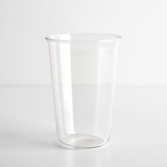 a clear glass sitting on top of a white table