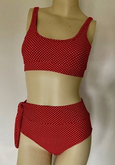 "Red polka dot bathing suit. High waist with tie. Fully lined Hand wash in cold water, mild detergent and line dry. No bleach, iron or dry clean Material is 4 way stretch, but not as stretchy as regular spandex. If on the fence with picking a size I would go up a size My spandex shorts and bras are made from Jalie patterns.If you would like more detailed  sizing information at this web site  http://www.jalie.com  Child/Youth Child-size 5  Chest 24 inches/Hip 24-25 Child size 6  Chest 25 inches/ Hip 25-26 Child size 7  Chest 26 inches/Hip 26-27 Child size 8  Chest 27 inches/Hip 27-28 Child size 10 Chest 28 inches/Hip 28-30 Child size 11 Chest 29 inches/Hip 31-32 Youth size 12 Chest 30 inches/Hip 31-32 Youth size 13 Chest 31 inches/Hip 32-33 Youth size 14 Chest 32 inches/Hip 33-34 Adult size Red Tie Back Swimwear For Pool, Red Tie-back Swimwear For Pool, Red Tie-back Summer Swimwear, Polka Dot Stretch Swimwear, Fitted Polka Dot Swimwear, Polka Dot Fitted Swimwear, Polka Dot Swimsuit, Fitted Polka Dot Beachwear Swimwear, Polka Dot Bathing Suit