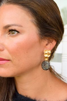 Discover elegance with the Lani Earrings. The signature multi-circle design is plated in gold, while the rhinestone dangle adds a touch of sparkle. Lightweight, nickel, and lead-free, these earrings are both fashionable and comfortable. Gold Round Linear Earrings For Party, Elegant Jeweled Hoop Earrings, Gold Cluster Drop Earrings For Evening, Elegant Jeweled Round Hoop Earrings, Gold Circle Clip-on Earrings, Elegant Gold Circle Clip-on Earrings, Elegant Circular Metal Earrings, Elegant Circle Metal Earrings, Gold Jeweled Crystal Earrings