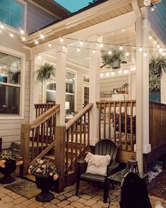 a porch with lights strung over it