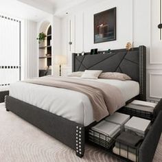 a bedroom with a large bed and white walls