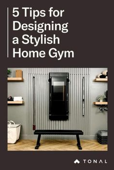 a black bench sitting in front of a mirror on top of a wooden floor next to shelves