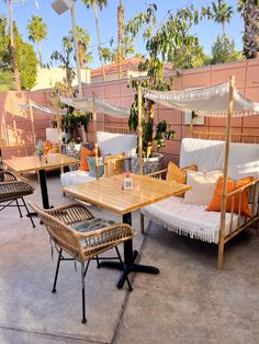 an outdoor seating area with tables and chairs