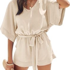 100% Polyester Pull On Closure Material: Breathable, Lightweight And Soft, Comfy To Wear Features: Rompers For Women Dressy Summer/ Casual V Neckline Short Jumpsuit/ Flowy Half Bell Sleeve/ Cutout Keyhole Back/ High Waist With A Self Tie Belt/ One Piece Playsuit With Short Pants And Side Pockets/ Loose Fit/ Solid Color Relaxed Fit V-neck Jumpsuits And Rompers For Vacation, Vacation Jumpsuits And Rompers With V-neck And Elastic Waistband, Belted Jumpsuits And Rompers For Spring Vacation, Summer Vacation Jumpsuits And Rompers With Belt, Chic Vacation Jumpsuits And Rompers With Tie Waist, Summer Relaxed Fit Jumpsuits And Rompers With Tie Waist, Relaxed Fit V-neck Jumpsuits And Rompers For Beach, Summer Beige Jumpsuits And Rompers With Elastic Waistband, Relaxed Fit V-neck Jumpsuit For Vacation