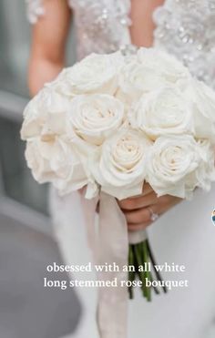 a bride holding a bouquet of white roses with the words, dressed with an all white long - stemed rose bouquet