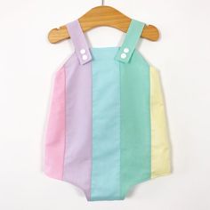 Pastel rainbow baby romper. Poppers for easy changing, relaxed fit, plenty of room for nappies (cloth or disposable). Fully lined with light soft cotton. Seamless insides making them comfortable against babies skin. Pastel rainbow design, repeated on the back. Carefully selected colours of luxury cotton. Adjustable length straps. Sleeveless Green Cotton Onesie, Playful Cotton Jumpsuits And Rompers For Playtime, Multicolor Spring Bodysuit For Playwear, Spring Multicolor Bodysuit For Playwear, Summer Cotton Overalls For Playwear, Summer Cotton Overalls For Playdate, Cute Multicolor Playtime Bodysuit, Multicolor Sleeveless Playwear Bodysuit, Playful Summer Onesie For Bedtime