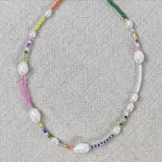 We are in love with our Rainbow & Pearls jewelry collection. This choker necklace is hand made with multi-colored seed beads and fresh water pearls. It's a little bit preppy, a little bit boho and a whole lot fo fun. Measures: 14.5" length with a 1" chain extension Gold plated clasp closure Hand made in one of our favorite European jewelry studios Folk House, Rainbow Pearl, European Jewelry, Pearls Jewelry, Diy Jewelry Necklace, Handmade Jewel, Pearls Necklace, Fresh Water Pearls, Jewelry Studio