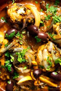 a bowl filled with black beans, onions and other food items on top of it