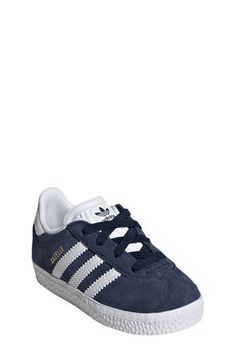 Initially designed in '91 as a training shoe for top athletes, the iconic Gazelle sneaker has been refreshed with stretchy laces for your little athlete. Pull-on style with elastic laces Leather and synthetic upper/textile lining/rubber sole Imported Casual Adidas High-top Running Sneakers, Athleisure Training Sneakers With Laces, Non-slip High-top Sneakers For Training, Casual Lace-up Skate Shoes For Training, Adidas Sports Sneakers, Adidas Lace-up Sneakers In Sportswear Style, Sporty Running Shoes With White Laces, Adidas Running Sneakers With Laces, Adidas Training Sneakers With Laces