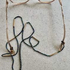 This Convenient Lariat Attaches To Your Eyeglasses So You Never Lose Them. Handmade. Purchased In A San Francisco Boutique. Pretty Iridescent Bugle Beads With Golden Accents And Tiny Black Pearls Make A Stylish Statement. Photograph Does Not Do This Justice. 30” Long. New; No Tags. Elegant Adjustable Beaded Glasses Chains, Elegant Adjustable Multicolor Glasses Chains, Beaded Metal Glasses Chains For Party, Metal Beaded Glasses Chains For Party, Eyeglass Holder, Bugle Beads, Glasses Accessories, Black Pearl, Handmade Accessories