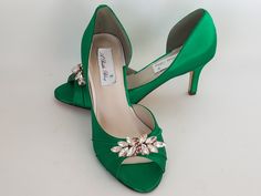 "Emerald Green Wedding Shoes with a sparkling crystal Rose Gold applique. Perfect shoes for your special day. The listing picture shoes a comfortable 2 1/2 inch heel (also available in 1 3/4 inch heel). The shoes in the listing have been dyed Emerald Green, but is also available in over 100 different colors as well as the option of sending us a sample to color match for you! If you would like a different heel size than the listing heel size of 2 1/2 inches, please leave us a note at checkout or Emerald Green Wedding Shoes, Green Bridal Shoes, Sparkle Wedding Shoes, Emerald Green Wedding, Blue Bridal Shoes, Gold Wedding Shoes, Ivory Bridal Shoes, Gold Applique, Sparkling Rose