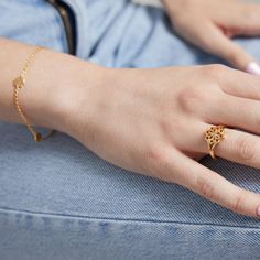 The Lotus Ring combines beauty and exquisite craftsmanship while adding a touch of grace to your daily wear. Designed to be able to stand out with a modern take on a tranquil flower. Available in yellow gold finish. Delicate Rose Gold-plated Ring, Adjustable Feminine Gold Ring, Classic Yellow Gold Flower Ring For Gift, Classic Yellow Gold Flower Ring As Gift, Elegant Gold Plated Flower Ring For Wedding, Elegant Gold-plated Flower Ring, Elegant Yellow Gold Plated Flower Ring, Elegant Gold Flower Ring, Gold Plated Open Flower Ring