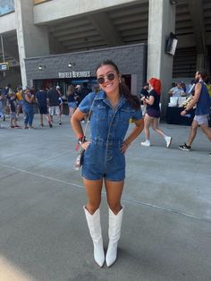 Tall White Cowboy Boots Outfit Concert, Denim Outfits For Concert, Country Concert Outfit Tall White Boots, Gameday Outfit With Cowboy Boots, Country Music Concert Outfit White Boots, Cowboy Boot Gameday Outfit, Romper With Cowboy Boots Outfit, Jean Romper With Cowboy Boots, Game Day Cowboy Boots