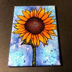 a painting of a sunflower on a blue background