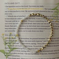 Beaded stretch elastic bracelet. One size. Faith of a mustard seed bible verse Luke 17:6. 6th bead is mustard seed. Spiritual Stretch Bracelet With Tiny Beads As Gift, Inspirational Adjustable Stretch Bracelet With Round Beads, Spiritual Gold Beaded Stretch Bracelet, Gold Spiritual Stretch Bracelet With Faceted Beads, Spiritual Gold Stretch Bracelet With Faceted Beads, Adjustable Gold Beads Spiritual Stretch Bracelet, Adjustable Spiritual Gold Beads Stretch Bracelet, Inspirational 8mm Beads Stretch Bracelet, Inspirational Stretch Bracelet With 8mm Round Beads