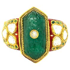 Indian Carved Emerald Diamond Enamel Bangle Bracelet Carved emerald of approximately 45-50 carats, rose-cut diamonds of approximately 6-8 carats total, featuring transparent red enamel set on yellow gold; center piece emerald (4.8 cm x 2.7 cm) Size: inner circumference 7.5 inches Total weight: 108.5 grams Carved Emerald, Vintage Bangles, Enamel Bangle, Vintage Bracelets, Rose Cut Diamond, Emerald Diamond, Rose Cut, Bangle Bracelet, Bangle Bracelets