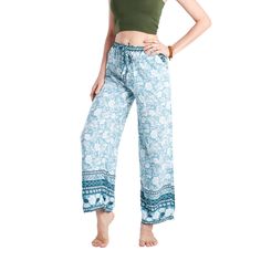 Handmade in Thailand 100% Natural Rayon Model is wearing Palazzo Pants in size M/ONE SIZE Machine wash in cold water for best results Our Palazzo Casual Pants are made with UltraSoft Rayon and have a large bow drawstring and lose leg bottoms. They come in a collection of boho prints and florals. This line is currently sold in M/ONE SIZE only. The pants are handmade and very light and comfortable to wear, especially in warm climates as the material breathes well. Perfect for lounging and great fo Blue Relaxed Fit Harem Pants For Beach, Bohemian Blue Wide Leg Pants For Loungewear, Bohemian Blue Straight Leg Pants, Blue Relaxed Fit Harem Pants For Vacation, Comfortable Blue Bottoms For Vacation, Blue Drawstring Pants For Loungewear, Casual Blue Pants With Drawstring, Bohemian Wide Leg Bottoms With Drawstring, Bohemian Blue Wide Leg Pants With Pockets