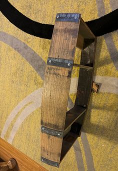 a wooden shelf sitting on top of a carpet