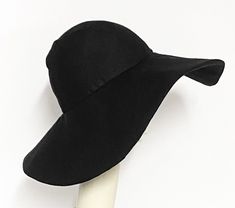 "Wide Brim sun hat made with black linen , lined in rayon print, the hat has a 2 section crown 3 1/2 \" in length and a one piece 5\" brim, a cotton band inside. One size fits most up to 23\" Machine wash cold / hand dry Made in USA Press if needed / packable" Black Lightweight Bucket Sun Hat, Lightweight Black Bucket Sun Hat, Black Lightweight Bucket Hat For Vacation, Black Bucket Hat With Upf 50+ For Vacation, Lightweight Black Hat For Beach, Lightweight Black Casual Sun Hat, Black Summer Sun Hat For Warm Weather, Black Lightweight Casual Sun Hat, Black Lightweight Hat With Uv Protection