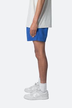 the Summer Shorts are constructed with a polyester fabric in a relaxed fit. The shorts feature an elasticized waist, welt pocket, and finished with a contrasting drawcord with a metal aglets. details elasticized self waist with drawstring relaxed fit 100% polyester model is 5’11, 140 lbs and wears a size medium Sporty Blue Swim Trunks With Built-in Shorts, Casual Summer Bottoms With Elastic Side Panels, Casual Bottoms With Elastic Side Panels For Summer, Casual Cotton Shorts With Elastic Side Panels, Casual Blue Swim Trunks With Built-in Shorts, Sporty Blue Athletic Shorts With Short Inseam, Blue Shorts With Side Pockets, Blue Relaxed Fit Athletic Shorts For Summer, Casual Bottoms With Elastic Side Panels