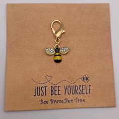 a keychain with a bee on it that says just bee yourself