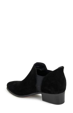 A soft suede bootie features stretchy gore panels for easy on-offs along with a cushioned footbed and a stacked block heel. 1 1/2" heel 4 1/2" shaft; 6 1/2" calf circumference Cushioned insole Leather and textile upper/synthetic lining/rubber sole Imported Fitted Black Suede Mid-calf Boots, Black Faux Leather Mid-calf Boots With Block Heel, Black Synthetic Booties Medium Width, Black Suede-lined Ankle Boots, Black Faux Leather Mid-calf Boots With Reinforced Heel, Kenneth Cole Reaction, Suede Booties, Kenneth Cole, Soft Suede