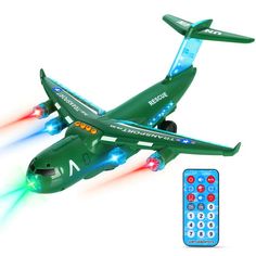 a toy airplane with lights and remotes is flying in front of a white background