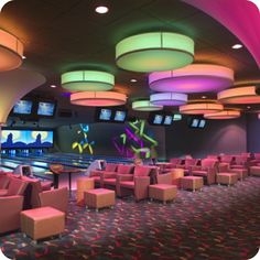 a bowling alley with pink chairs and neon lights