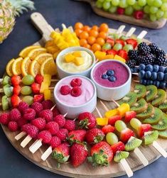 various fruits and dips arranged on a platter