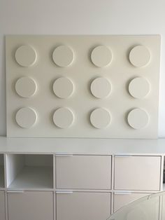 a white wall with several circles on it